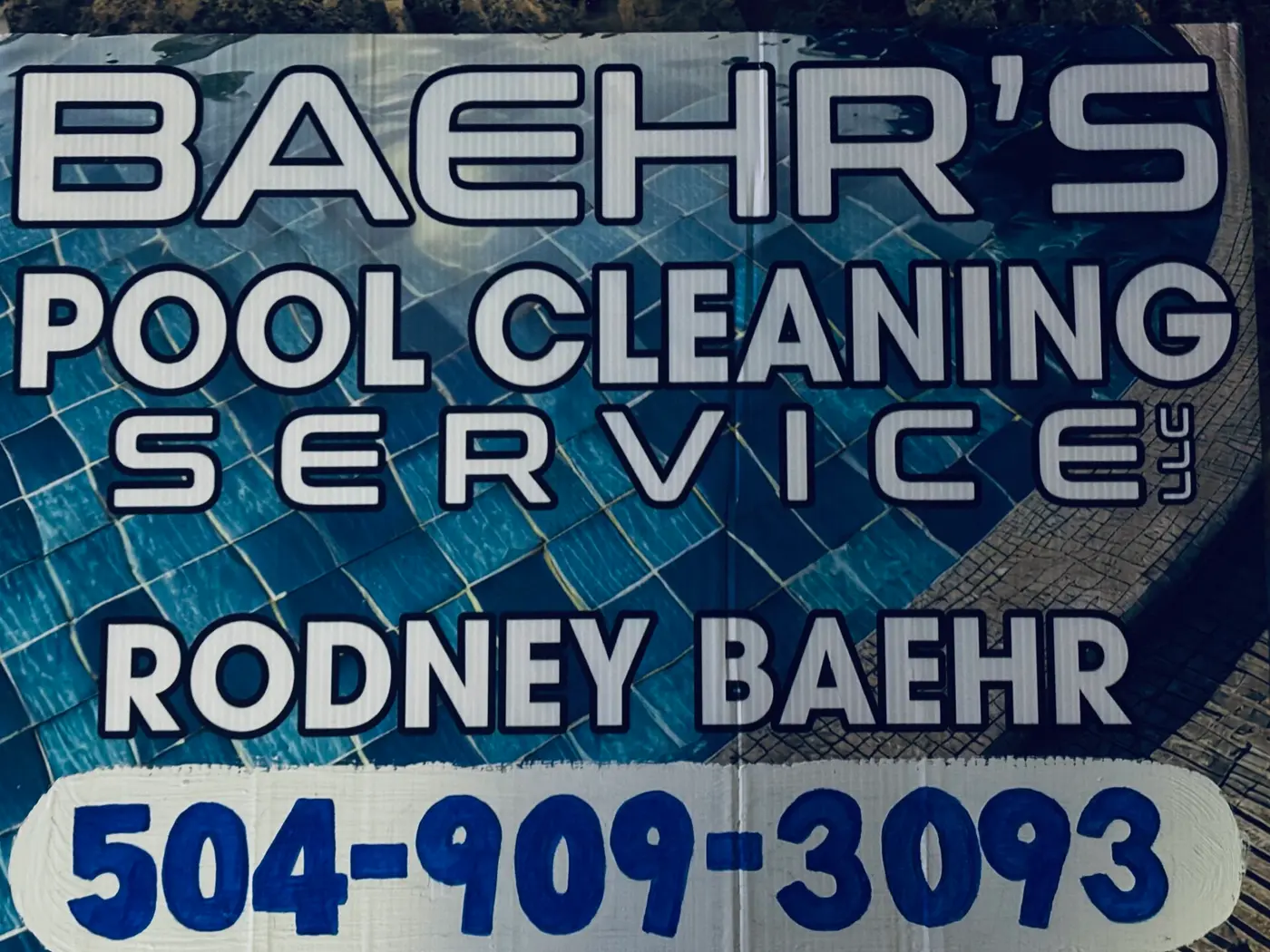 The actual Baehr's Pool Cleaning Service LLC yard sign: Rodney Baehr, 504-909-3093 painted by hand
